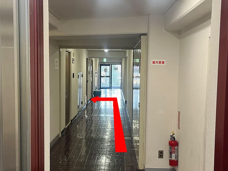 After exiting the elevator, go straight.