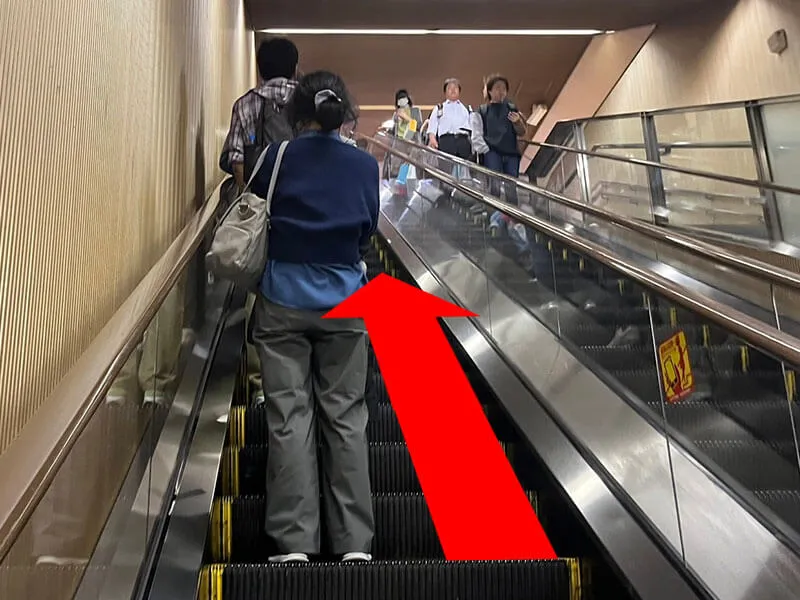 Please go up the escalator.