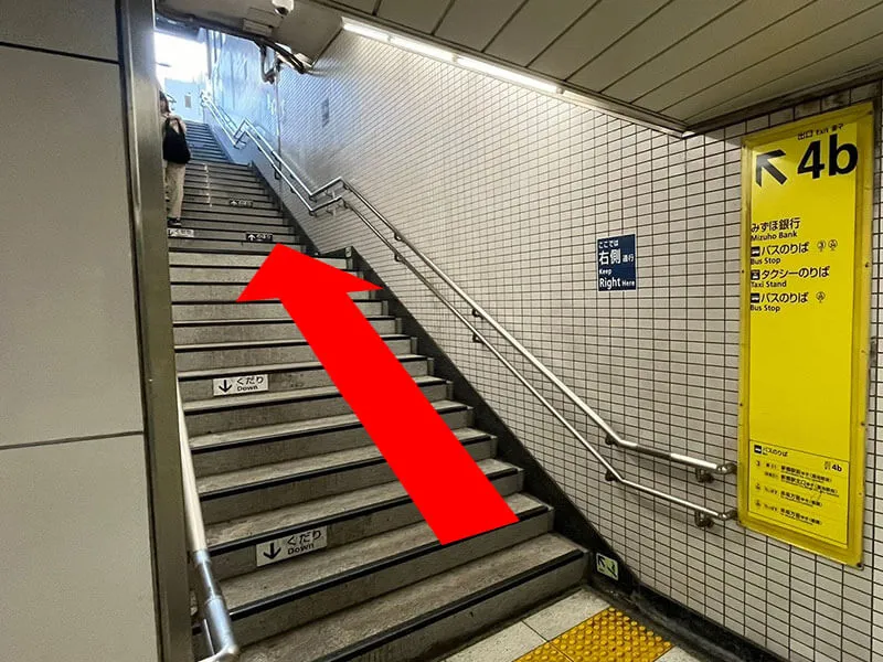 Please go up the stairs.